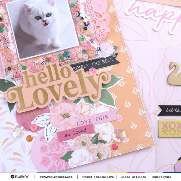 hand-made paper-craft scrapbooking layout by Diane Williams (Dearly Dee) using Primavera by Rosie's Studio. Showcasing diecut cardstock ephemera sentiments and florals, machine stitching with 12 x 12 papers and her British Shorthair cat Pearl