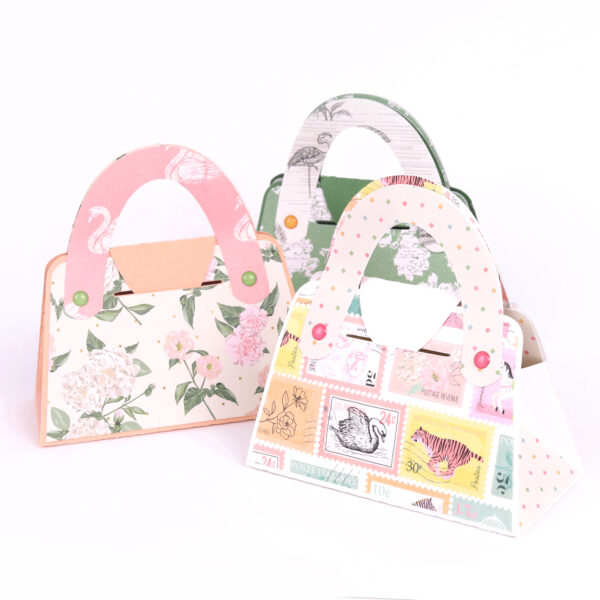 hand-made paper-craft handbags by Lissa Rees using Primavera by Rosie's Studio. Showcasing washi tape stamps along with 12 x 12 papers and epoxy scatters